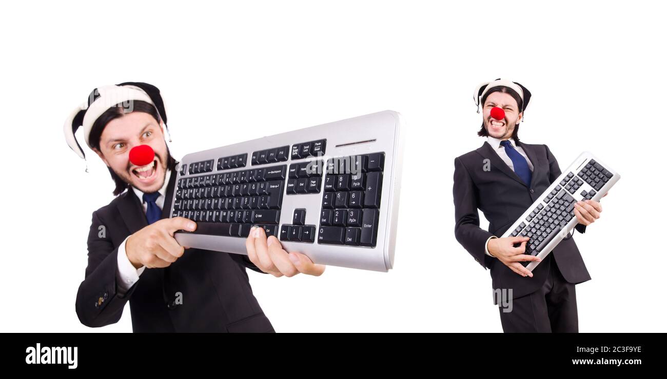 Funny clown with keyboard isolated on white Stock Photo Alamy
