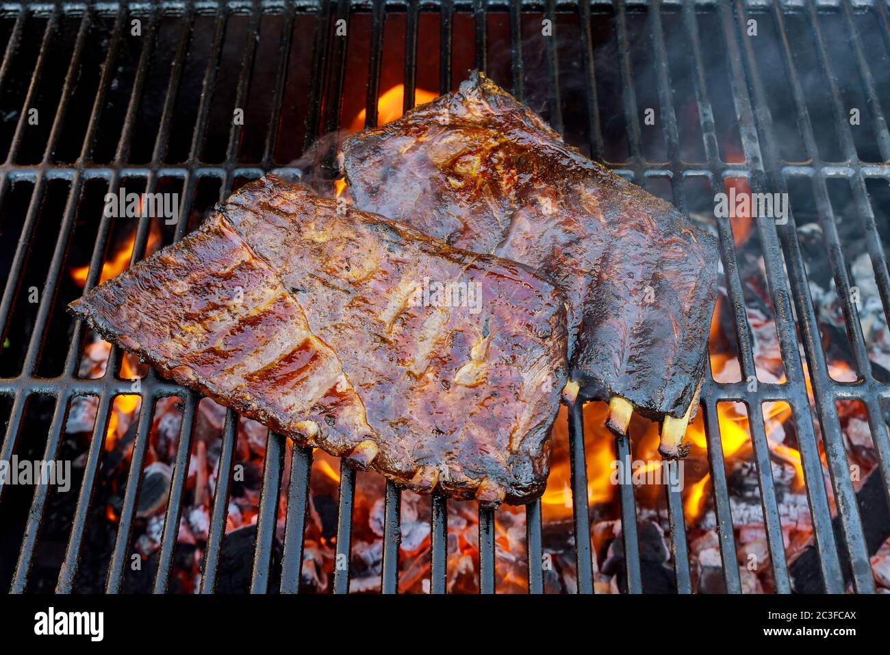 Ribs on barbecue grill fire hi-res stock photography and images - Alamy