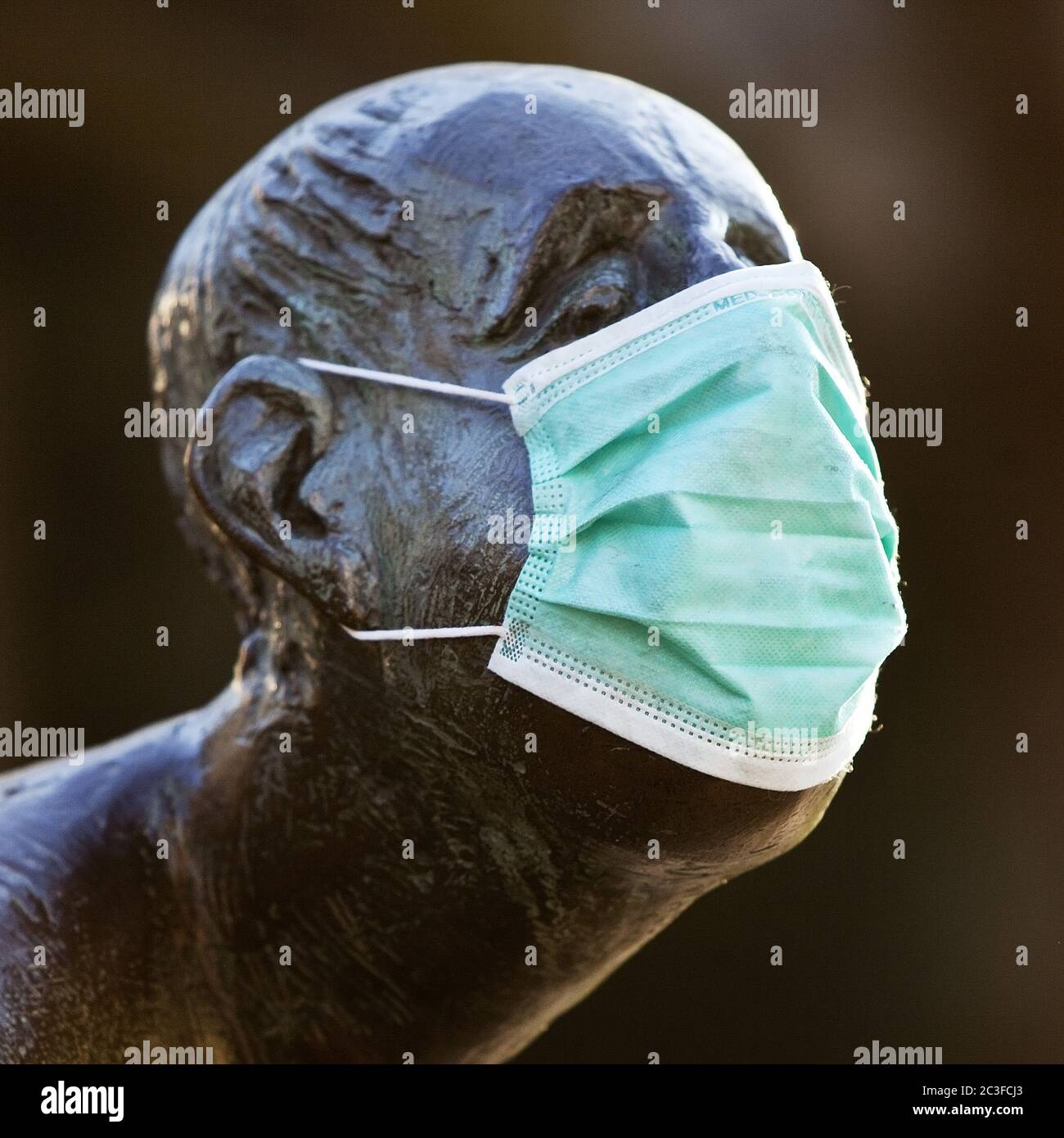 Sculpture with protective mask,  Kreislauf des Geldes, Coronavirus, Aachen, Germany, Europe Stock Photo