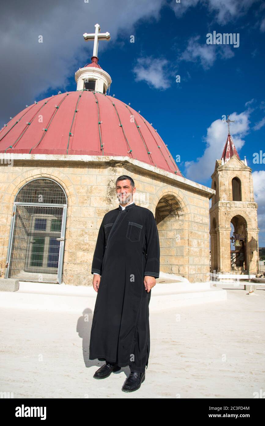 Father Andre Bahus outside his congregation in Shefar, Israel Stock Photo