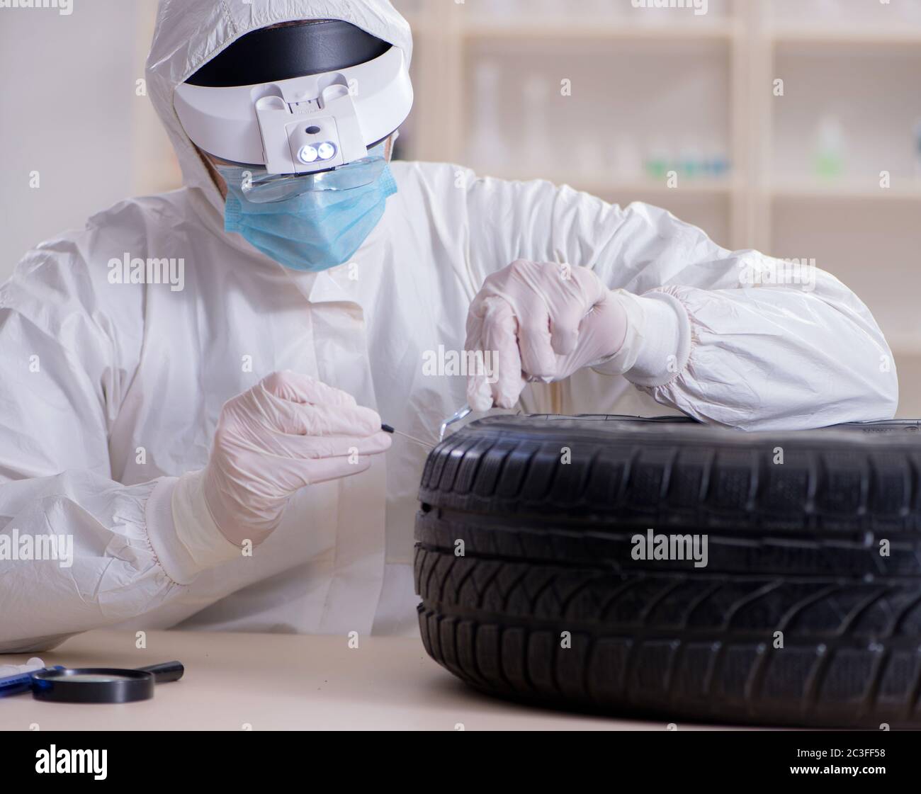 Expert is looking at car accident evidence Stock Photo Alamy