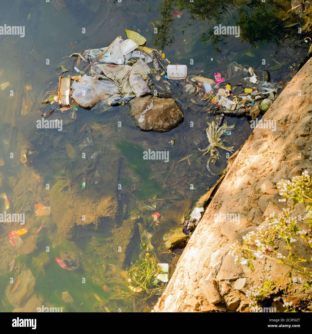 Discharge of sewage into a body of water in Myanmar. Stock Photo