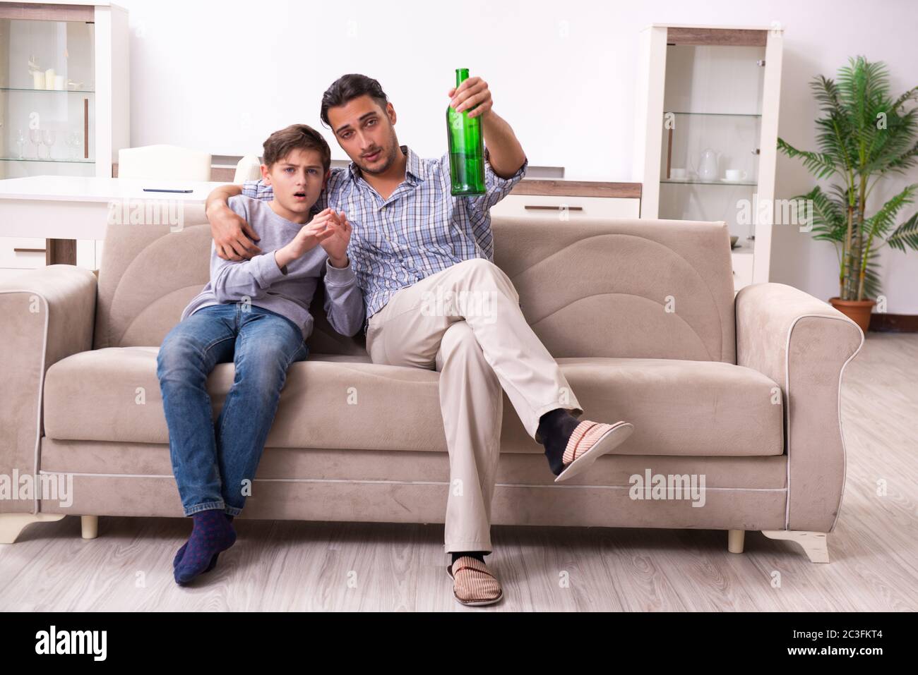 Drunk father and his son Stock Photo