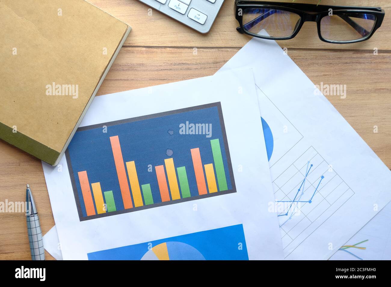 financial graphs on office table, using self created chart Stock Photo ...