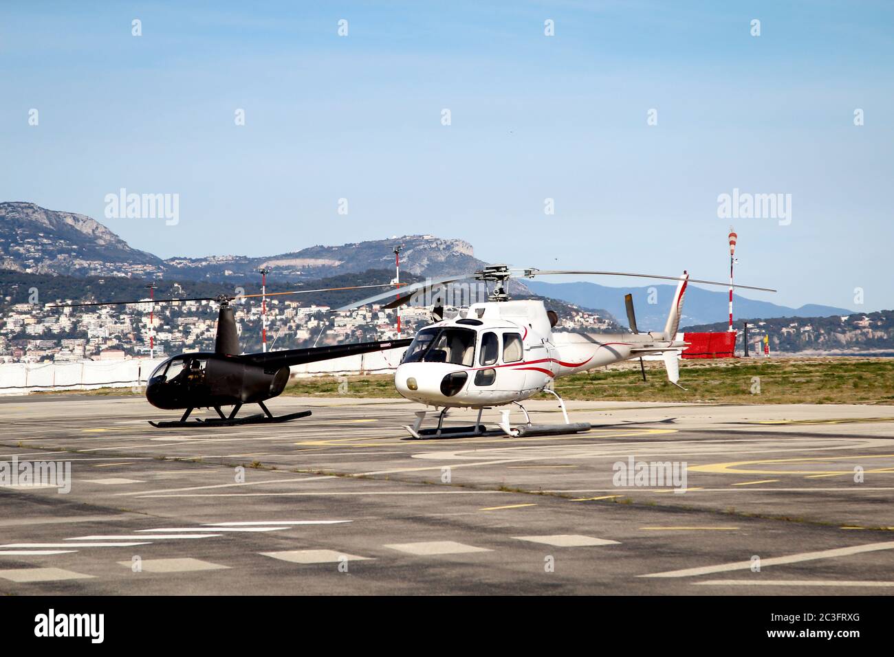 A helicopter on, over the helipad, only ever carries a few passengers Stock Photo