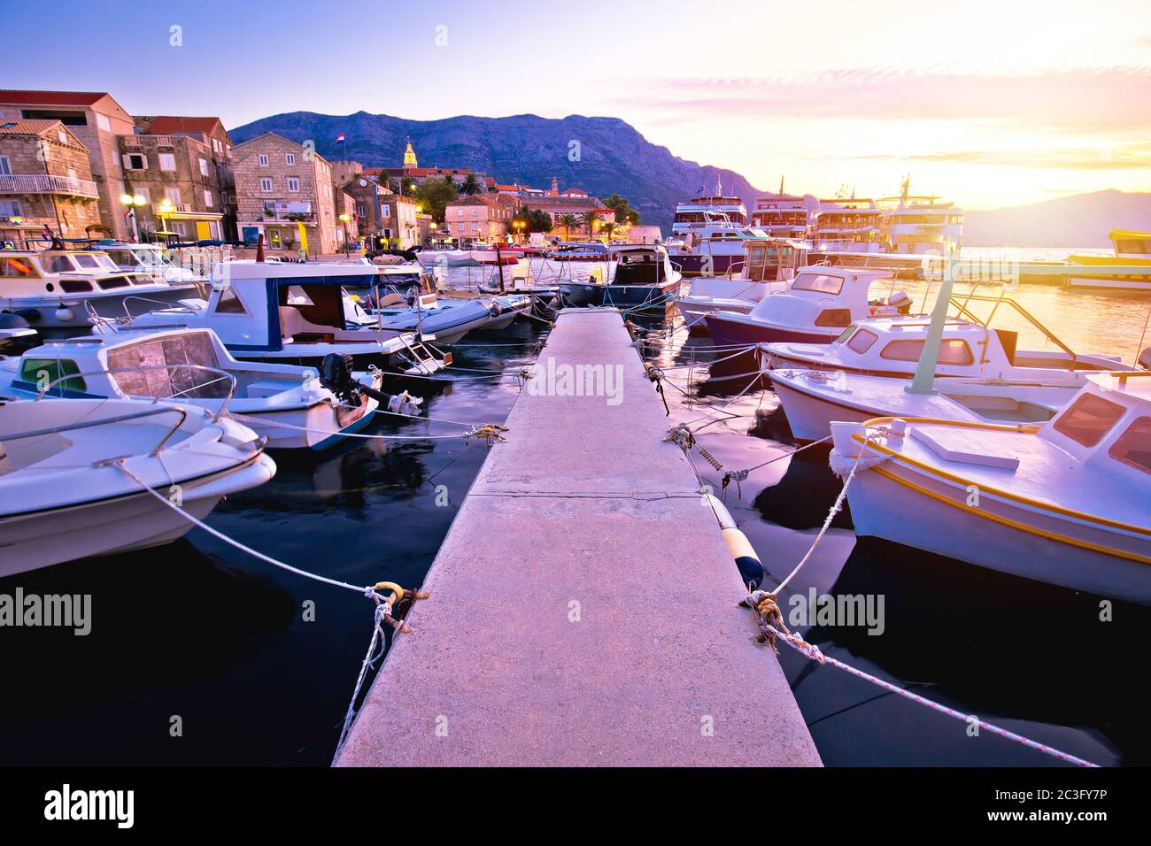 Town of Korcula coastline and harbor colorful sunset view Stock Photo