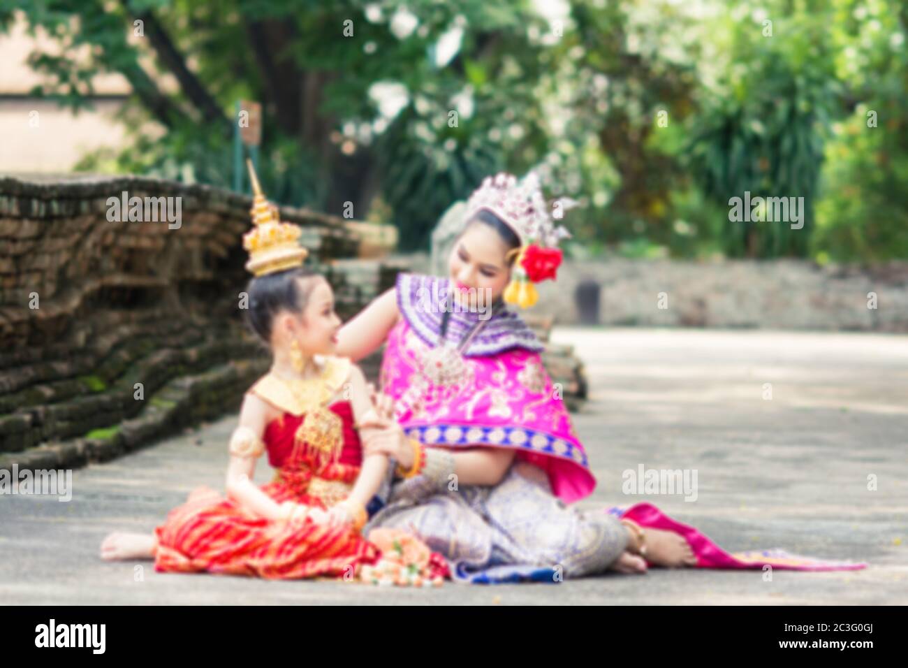 Asian woman wearing typical, traditional Thai Dress. It is literally means Thai outfit, National costume. Stock Photo