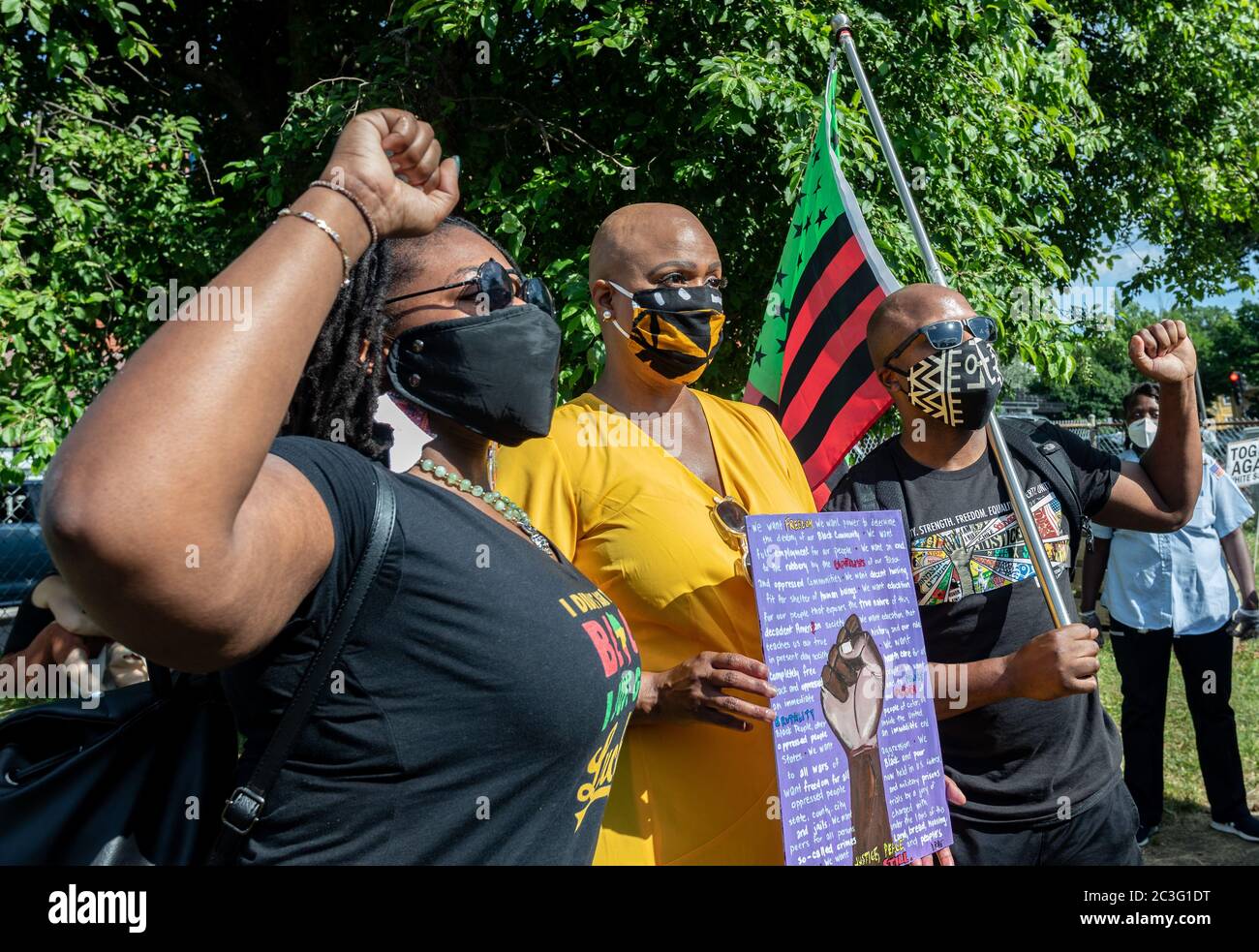 June 19, 2020, Boston, Massachusetts, USA: U.S. Rep. Ayanna Pressley (D-MA) poses a photo with people holdng a stylized American Black Lives Matter flag during a Juneteenth rally in Boston. Juneteenth commemorates when the last enslaved African Americans learned in 1865 they were free, more than two years following the Emancipation. Credit: Keiko Hiromi/AFLO/Alamy Live News Stock Photo