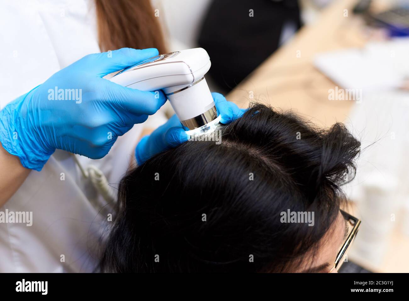 Microscopic examination of the hair and skin of the scalp Stock Photo