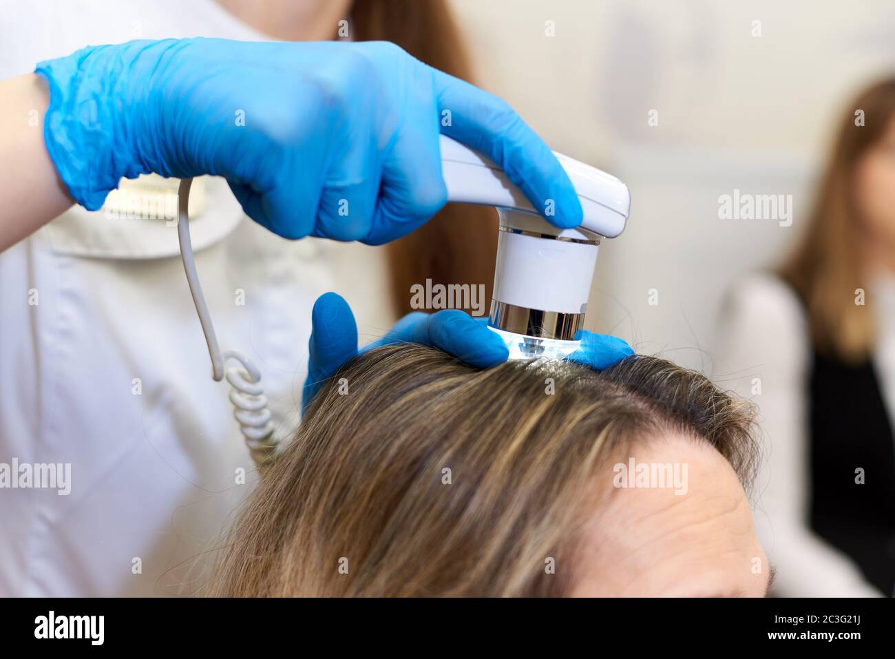 Microscopic examination of the hair and skin of the scalp Stock Photo