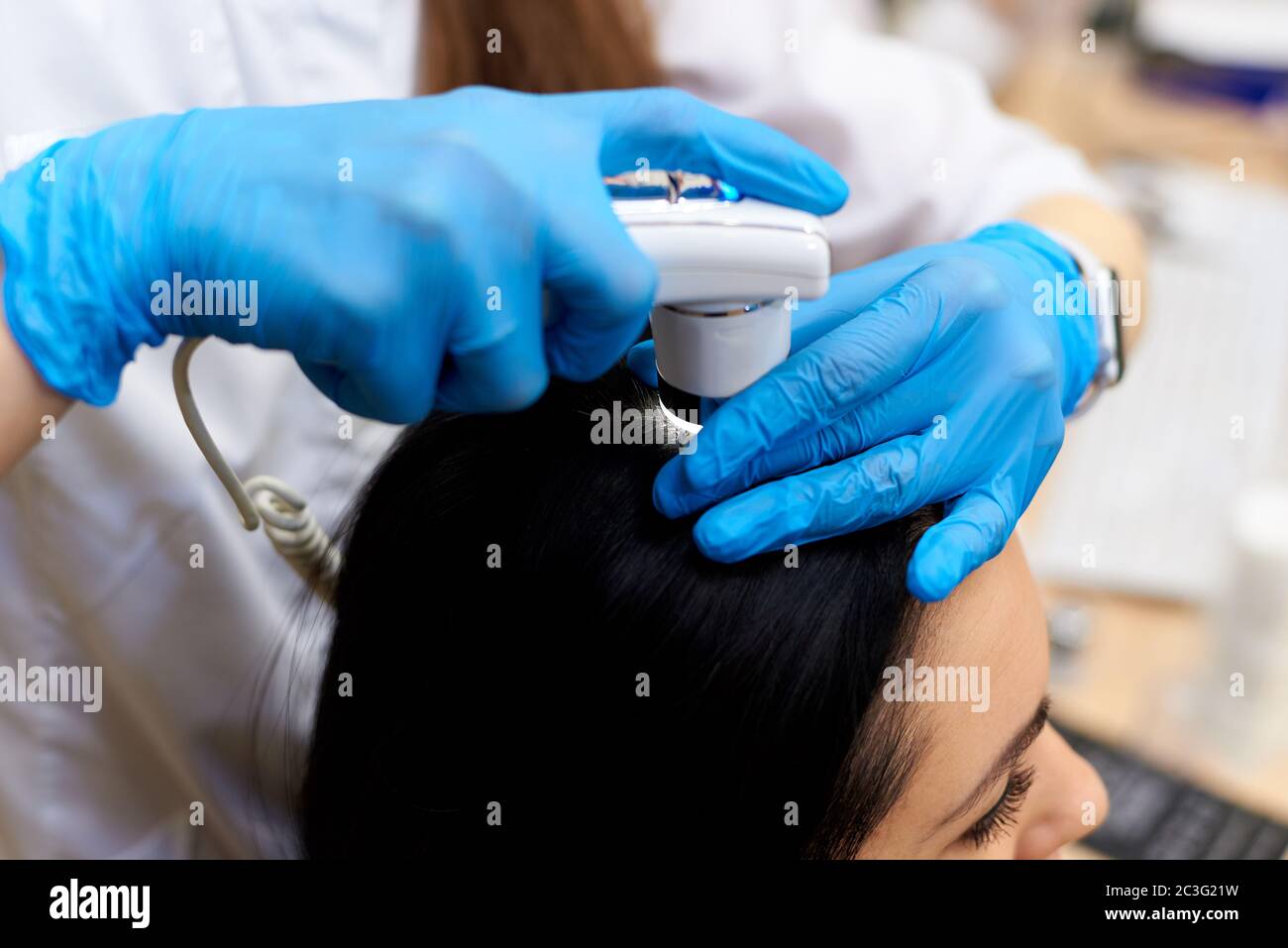 Microscopic examination of the hair and skin of the scalp Stock Photo