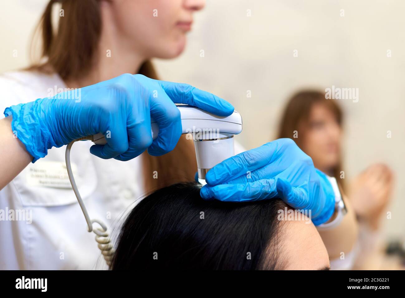 Microscopic examination of the hair and skin of the scalp Stock Photo