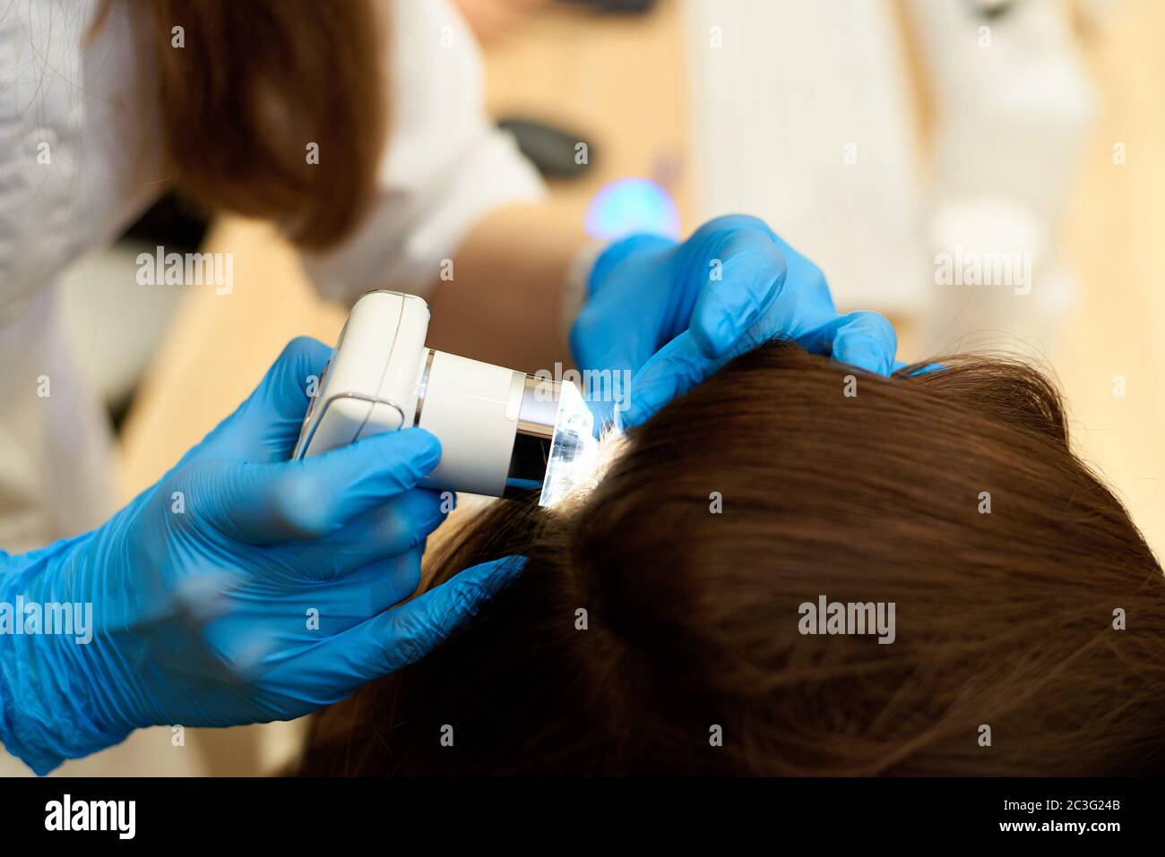 Microscopic examination of the hair and skin of the scalp Stock Photo