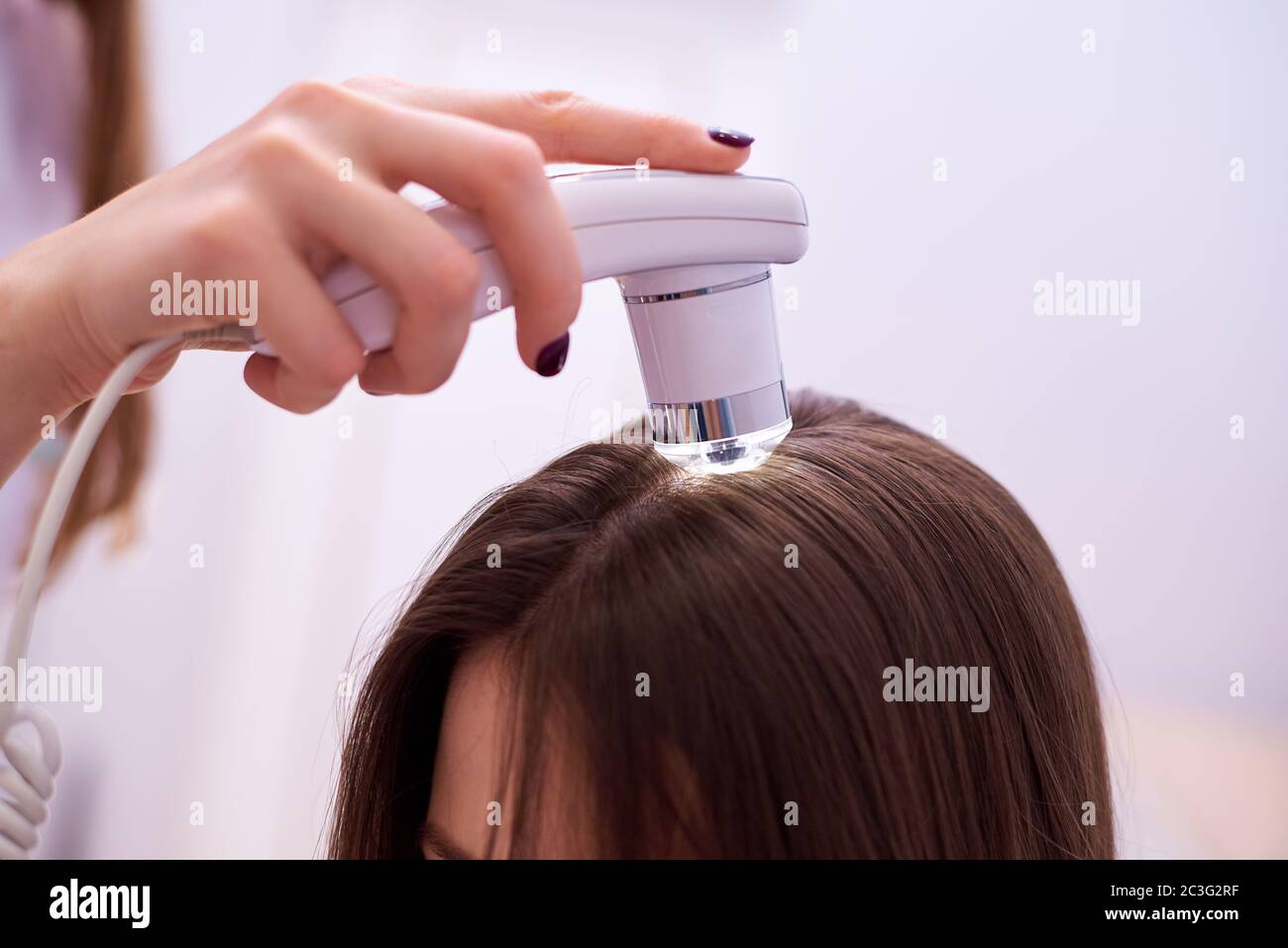 Microscopic examination of the hair and skin of the scalp Stock Photo