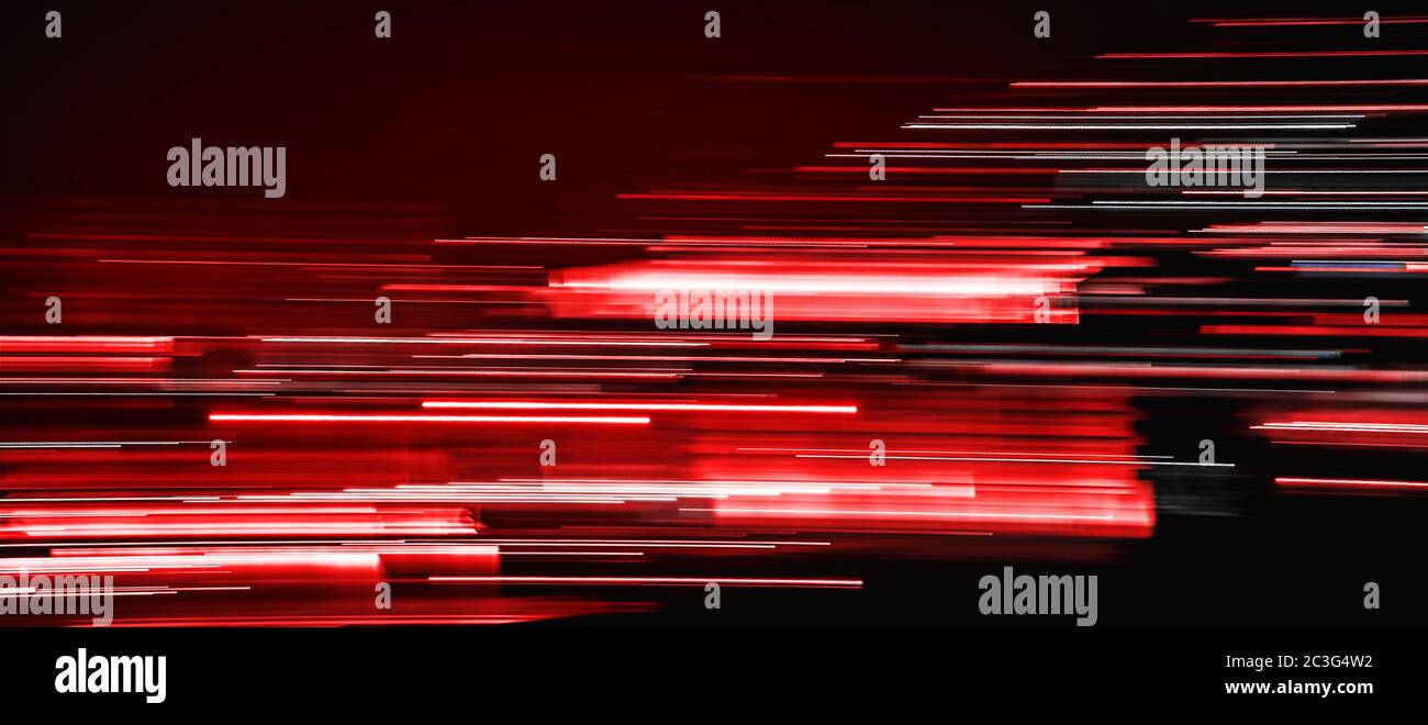 red light trails on dark background Stock Photo - Alamy