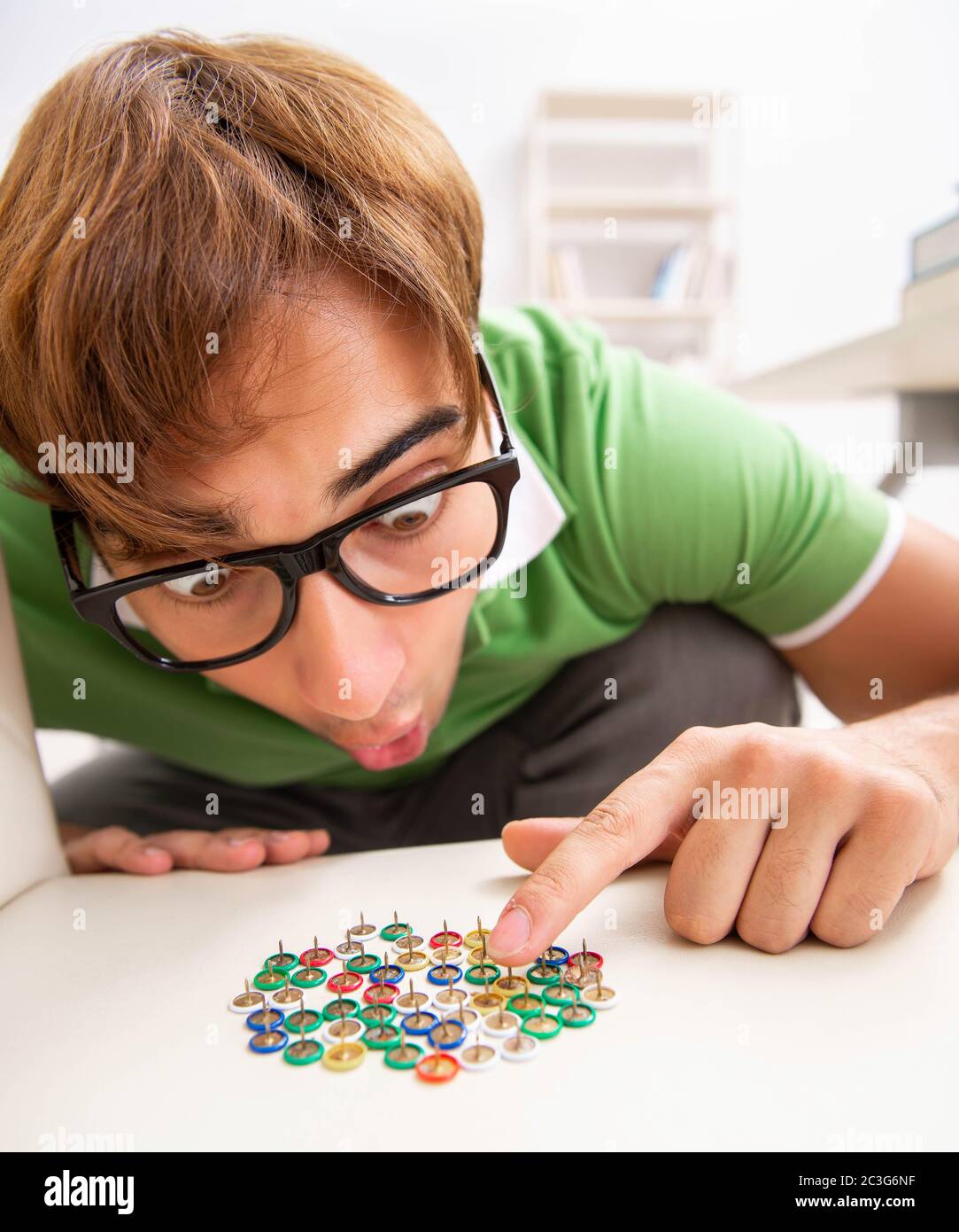 Office prank with sharp thumbtacks on chair Stock Photo Alamy