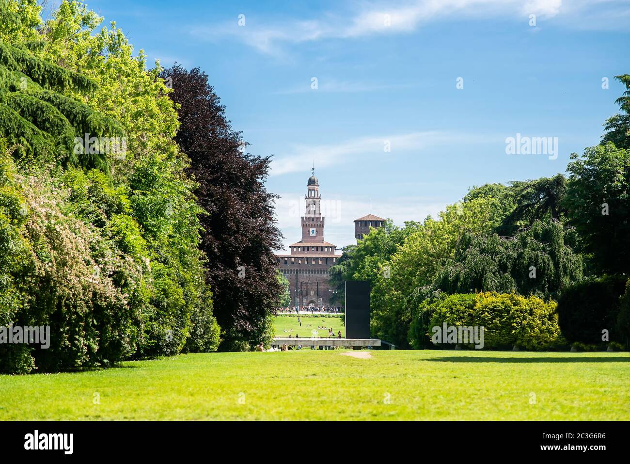 Sempione Park (Parco Sempione) in Milan, Italy. Sforza Castle. Filarete Tower. Blue Sky. Sunny Day. Stock Photo