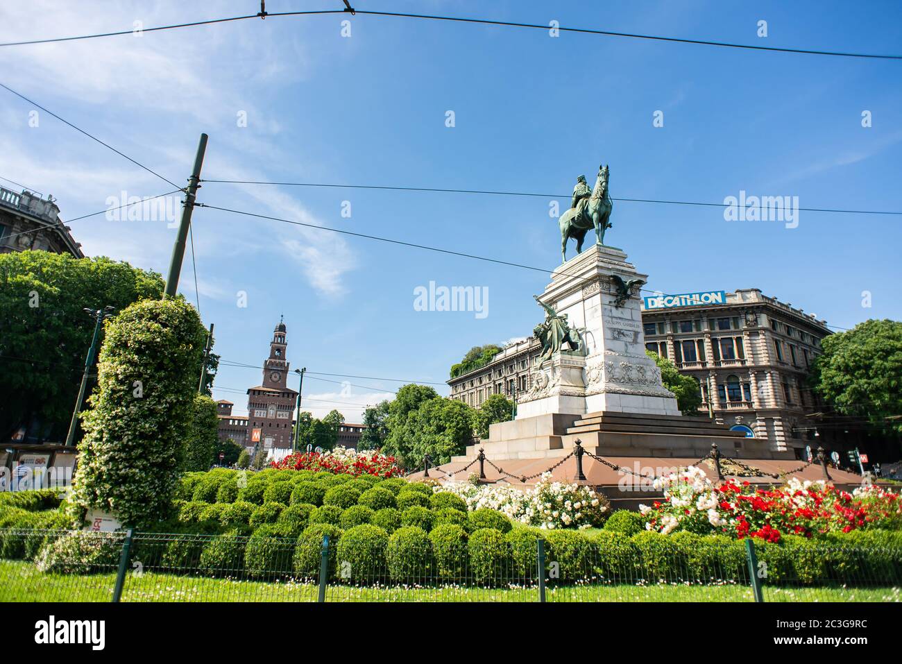 Milan. Italy - May 21, 2019: Giuseppe Garibaldi Monument in Milan and Sforza Castle (Castello Sforzesco). Cairoli Square. Stock Photo