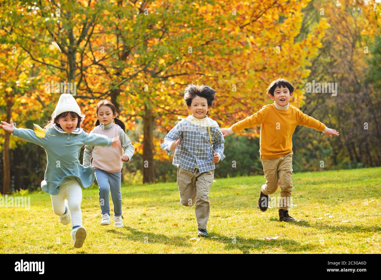 The children happy running in the park Stock Photo - Alamy
