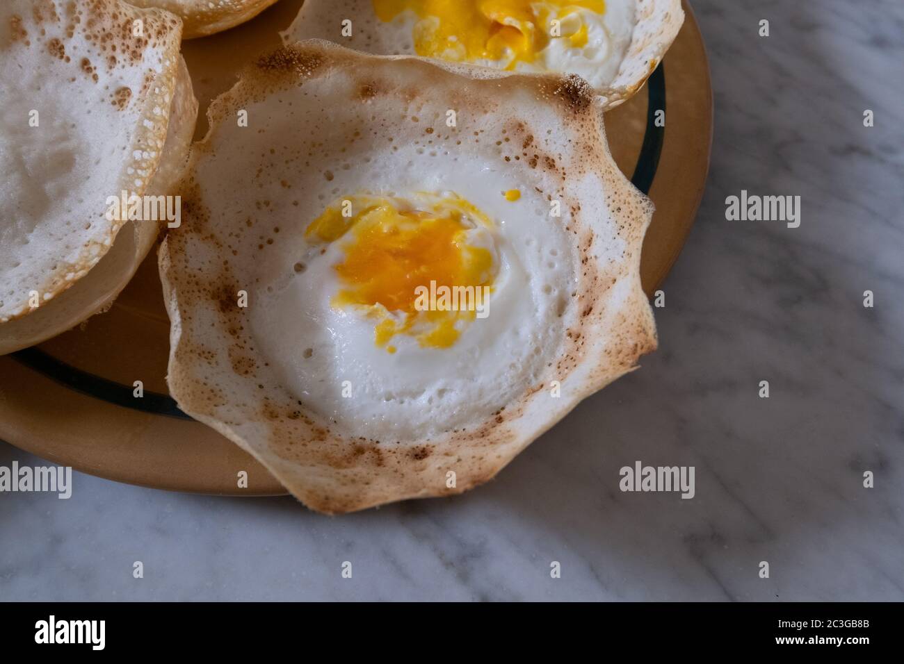 breakfast with homemade sri lankan egg hopper, bittara aappa Stock
