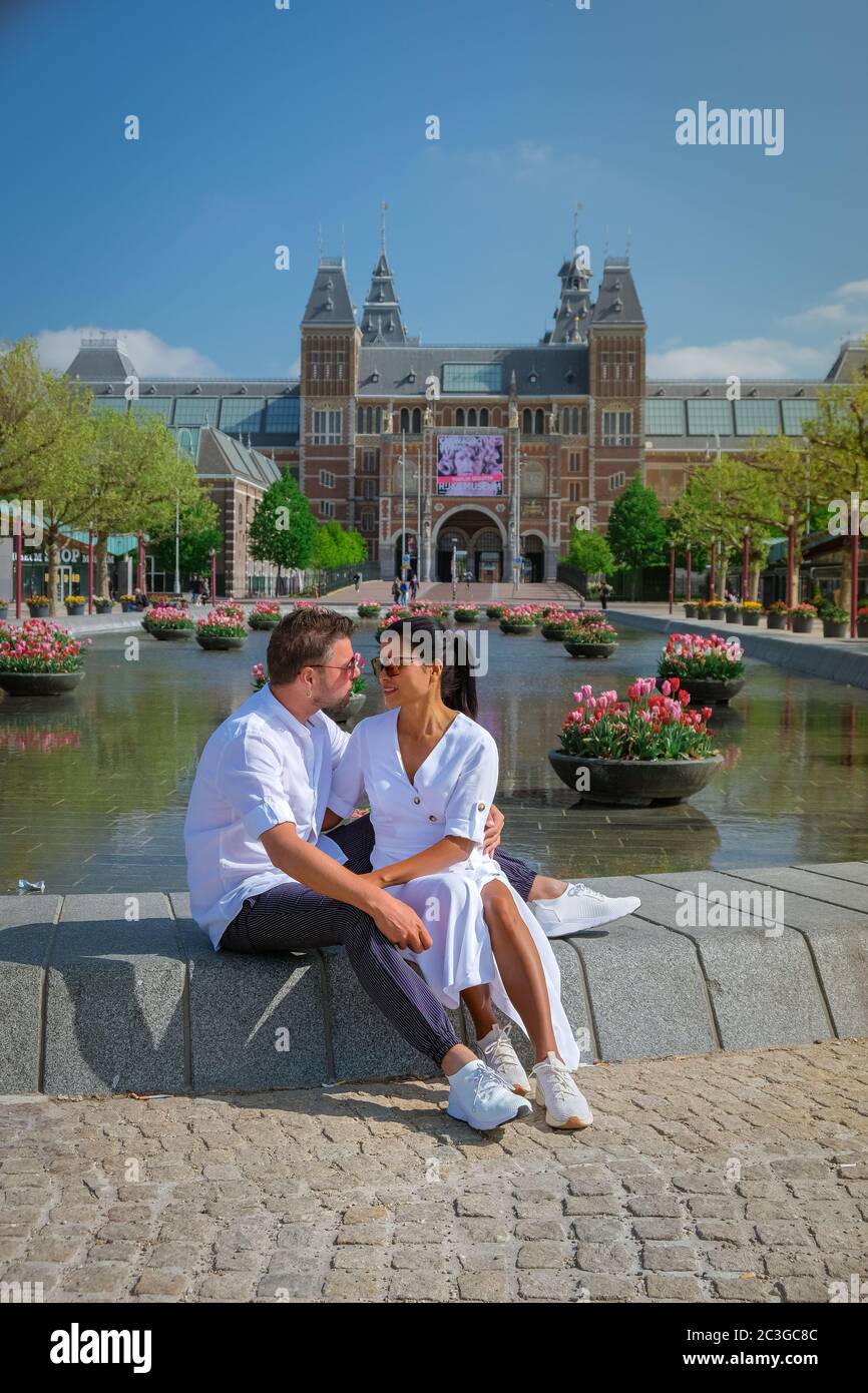 Amsterdam Netherlands April 2020, almost empty Amsterdam Rijksmuseum square during the corona covid 19 outbreak virus in Europe Stock Photo