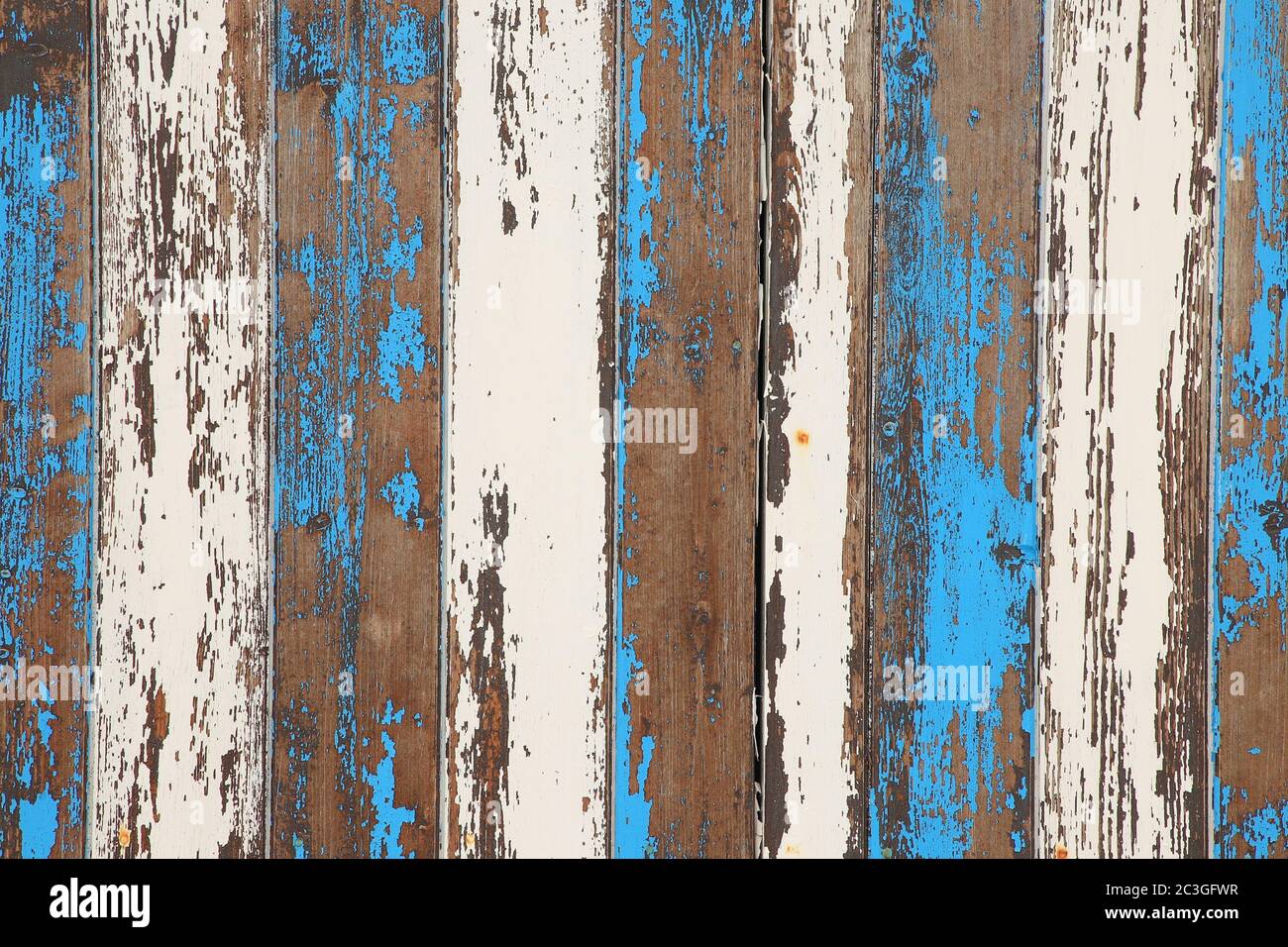 old wooden panel backdrop of paint peeling off surfaces Stock Photo