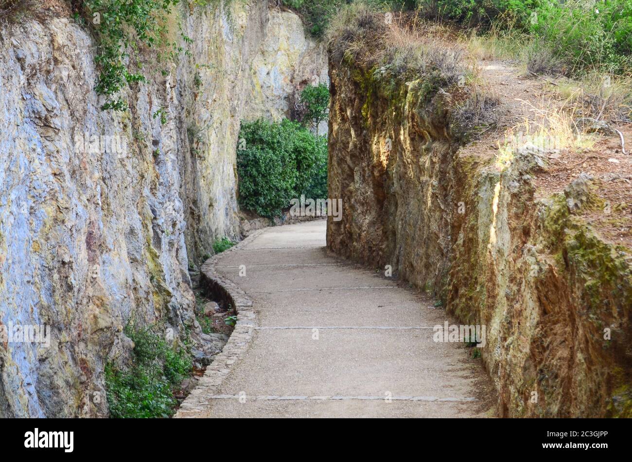 path leading to the Hill of the Three Crosses in Güell Park in Barcelona, Spain Stock Photo