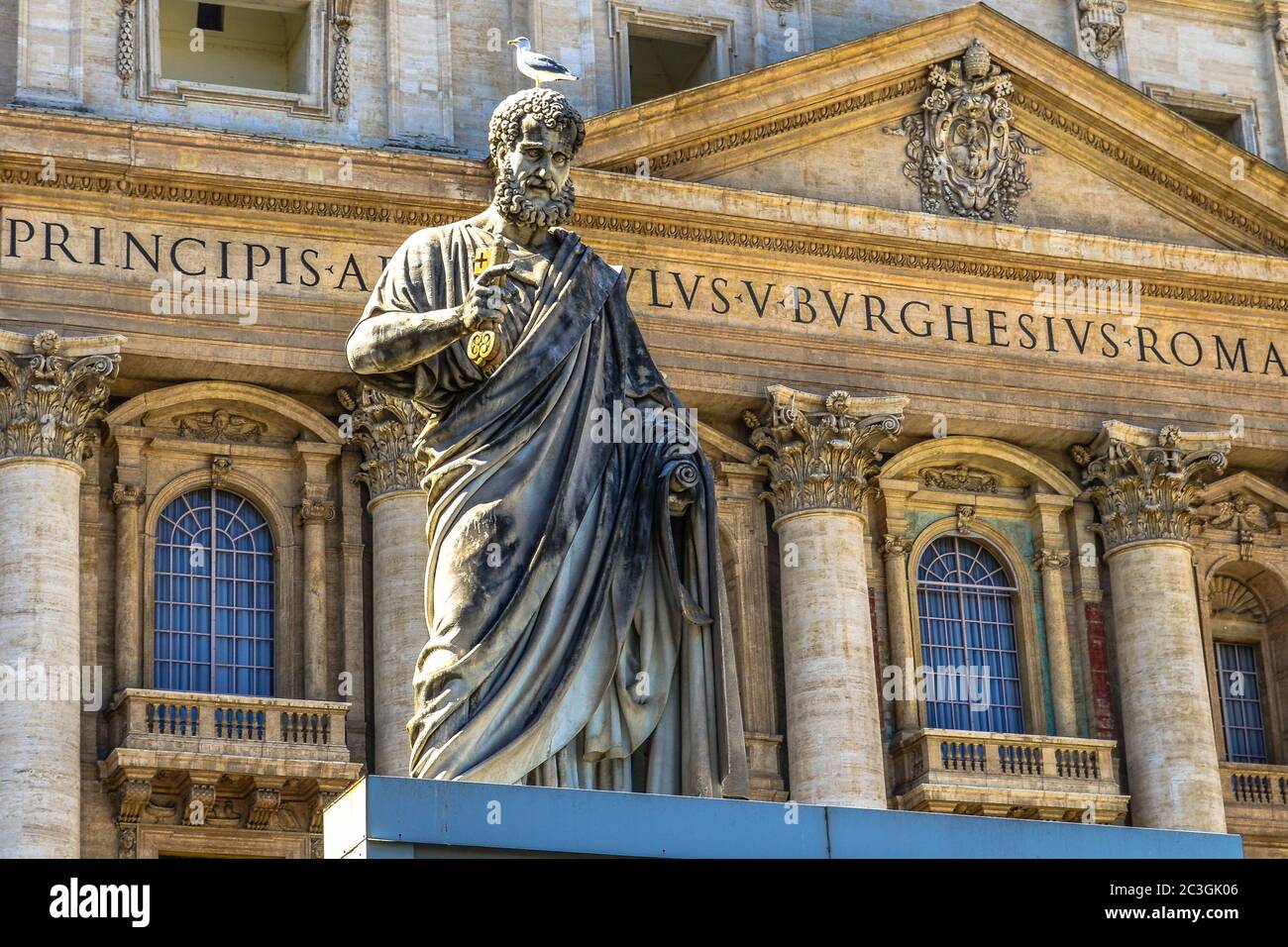 Statue of Saint Peter and Saint Peter's Basilica at background in St