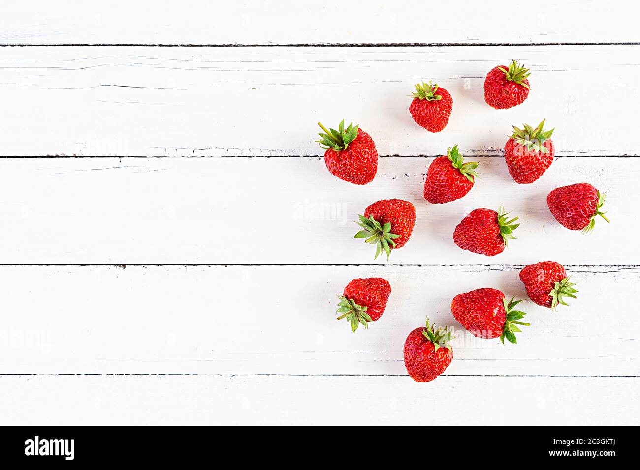 Sweet fresh ripe strawberry isolated on white wooden background Stock ...
