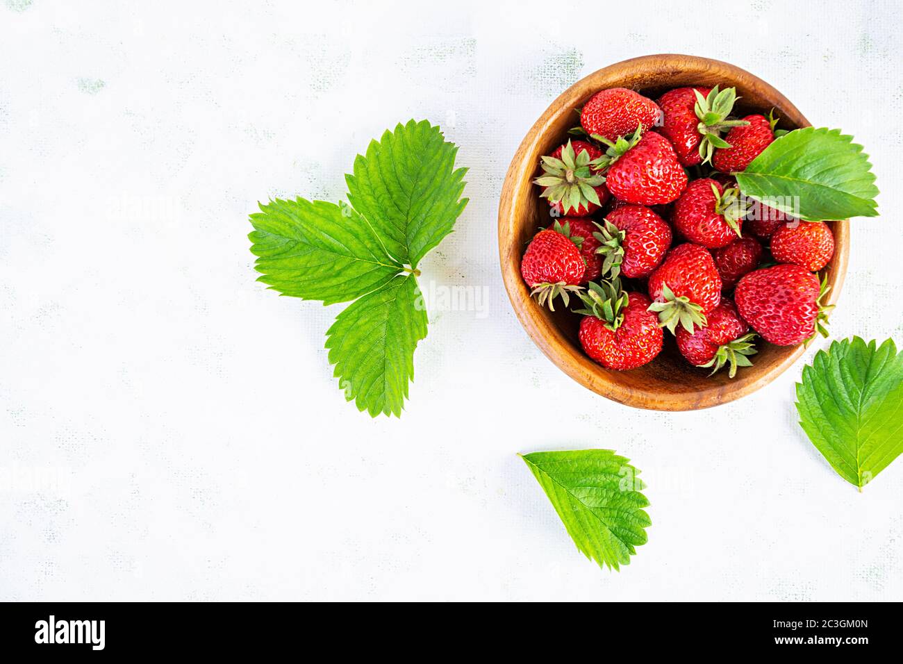 Sweet fresh ripe strawberry isolated on white wooden background Stock ...