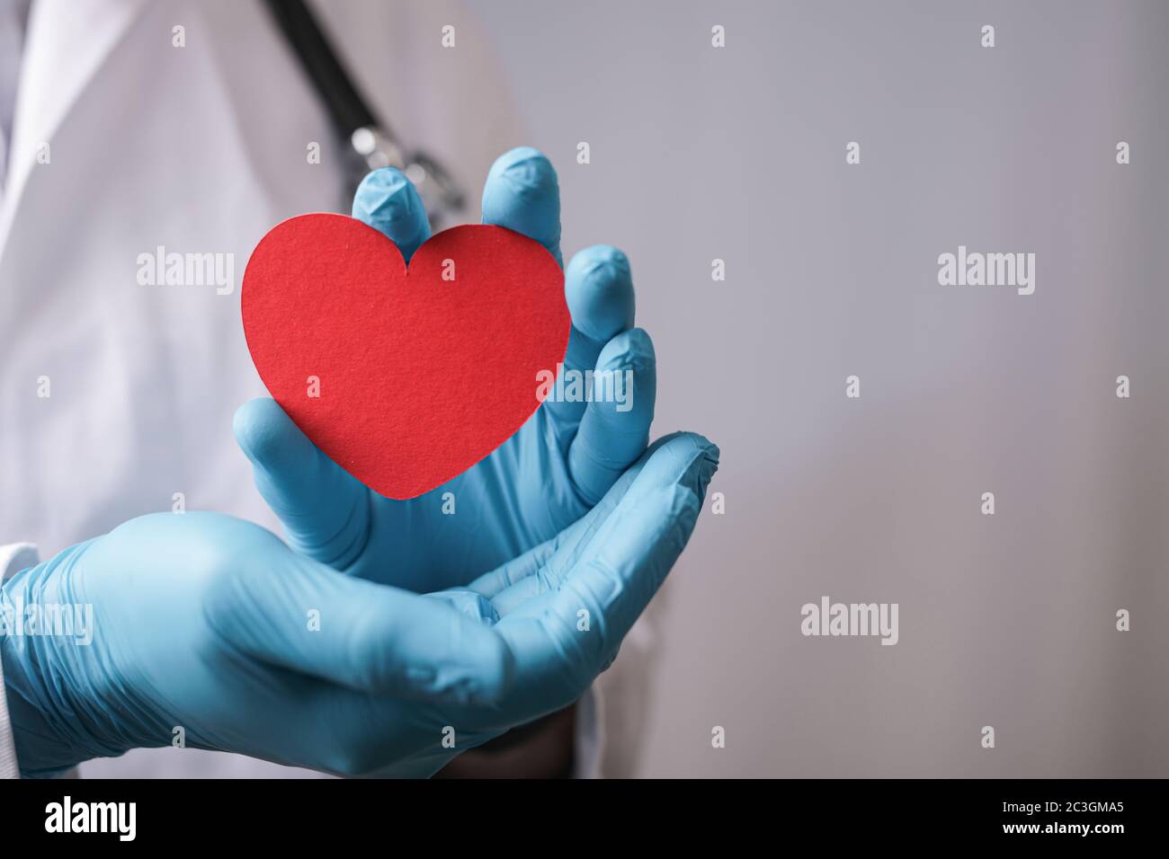 Paper heart in hands hi-res stock photography and images - Alamy