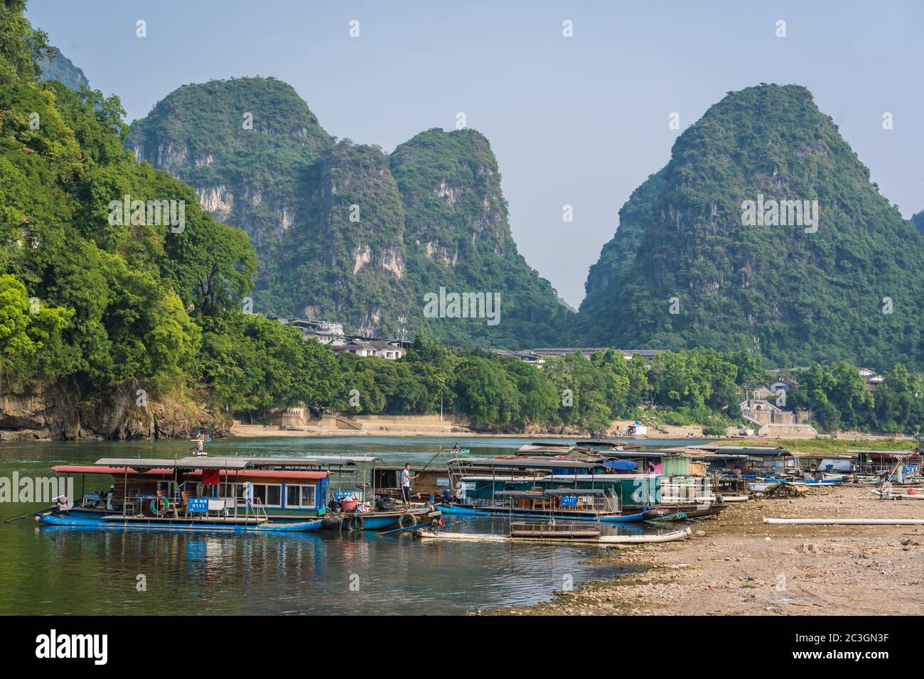 Local boats on the riverbank of Li River in Yangshuo Stock Photo