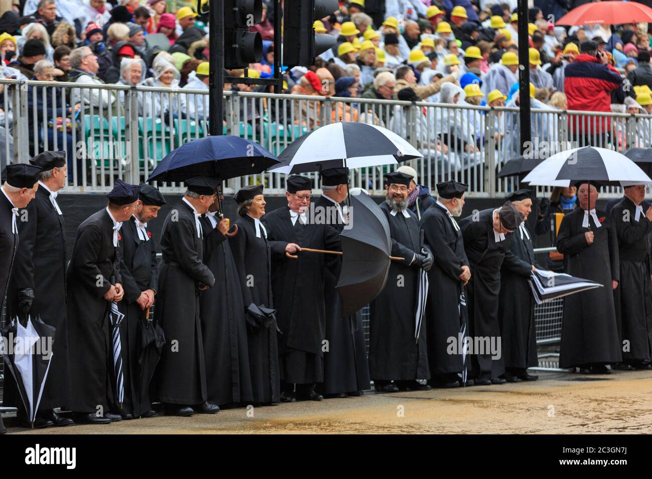 Clergy with umbrellas are lined up awaiting the parade at Lord Mayor's Show 2016 in the City of London, England, UK Stock Photo