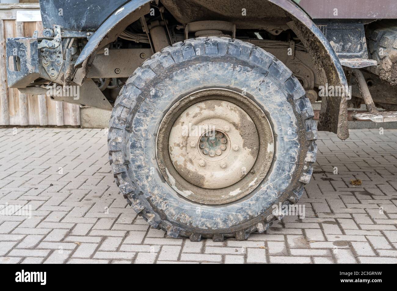 Tires and wheel arch of a dirty off-road truck Stock Photo