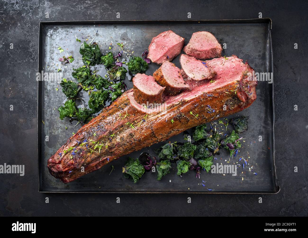 Barbecue dry aged venison tenderloin fillet steak and saddle natural