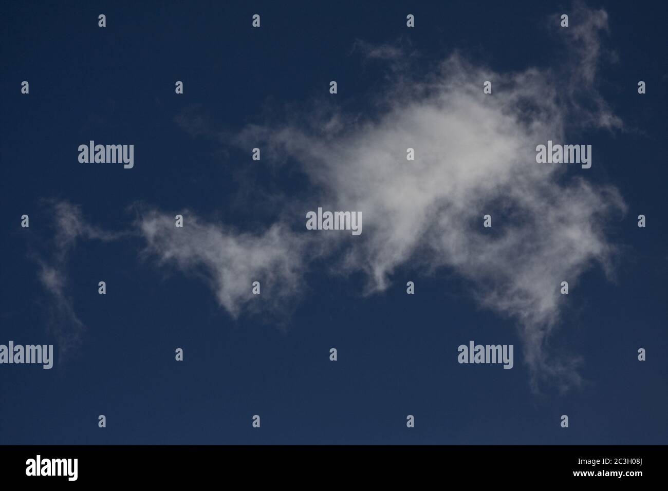 Low angle shot of white clouds in a blue sky at daytime Stock Photo - Alamy