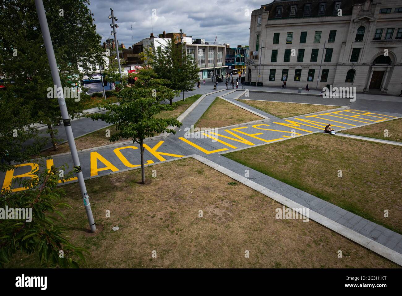 The words 'Black Lives Matter' painted in yellow, covering the length of the walkway from Thomas Street to General Gordon Place in the centre of Woolwich, south London. Stock Photo