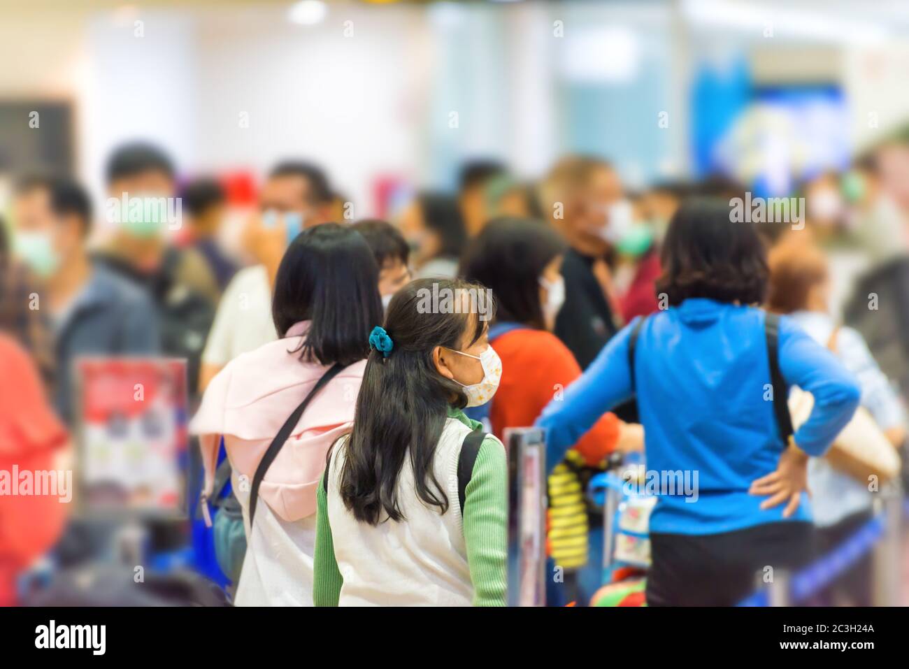 Crowd of people waiting in airport Stock Photo