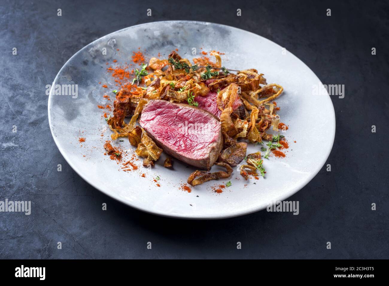 Barbecue dry aged beef fillet medallion steak natural with fried onion