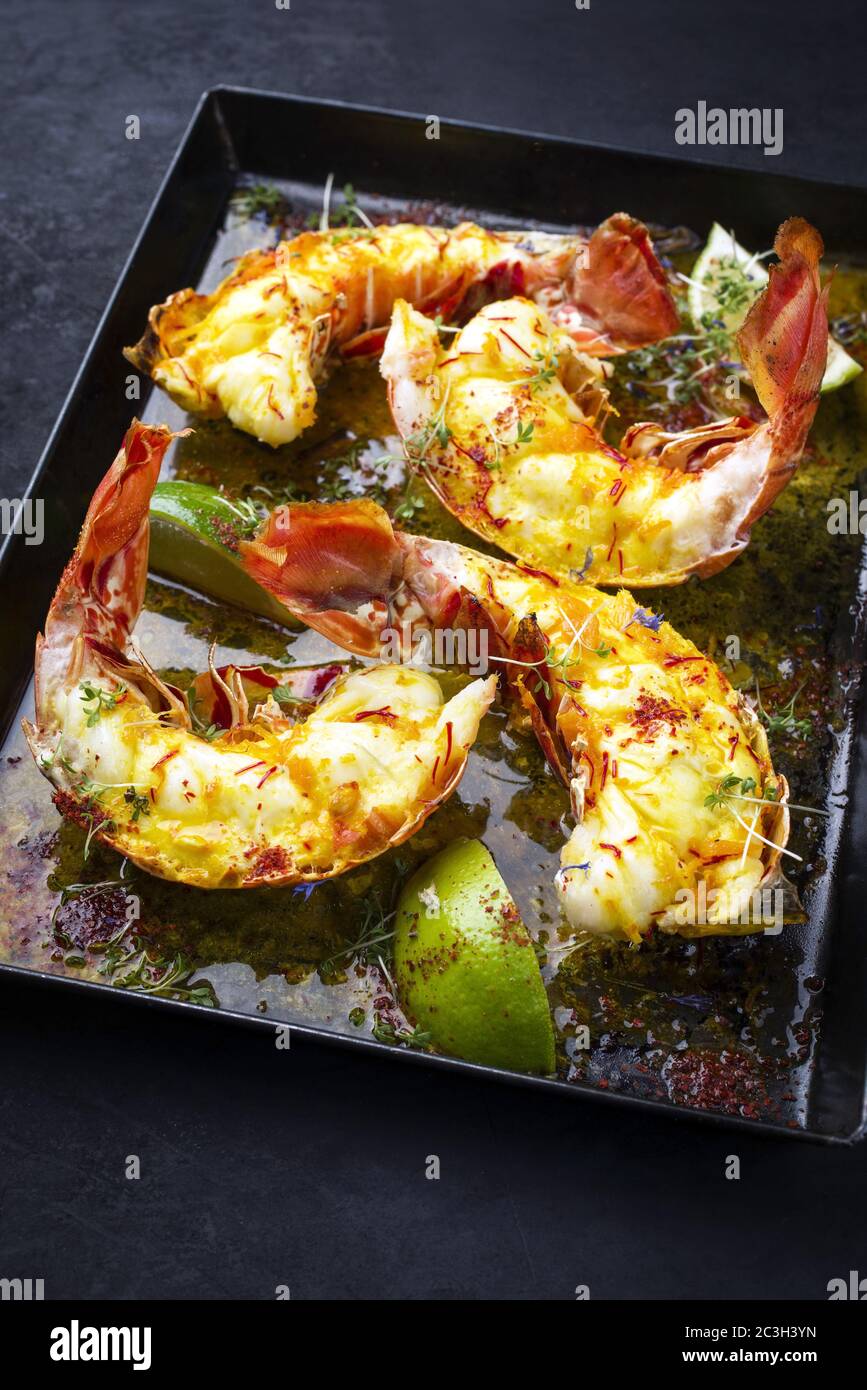 Traditional barbecue spiny lobster tail sliced and offered with saffron