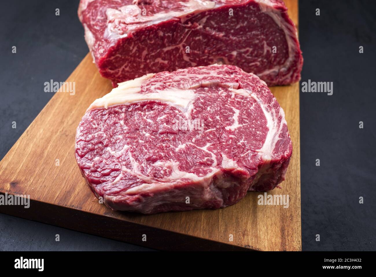 Raw dry aged wagyu entrecote beef steak roast as top view on a modern