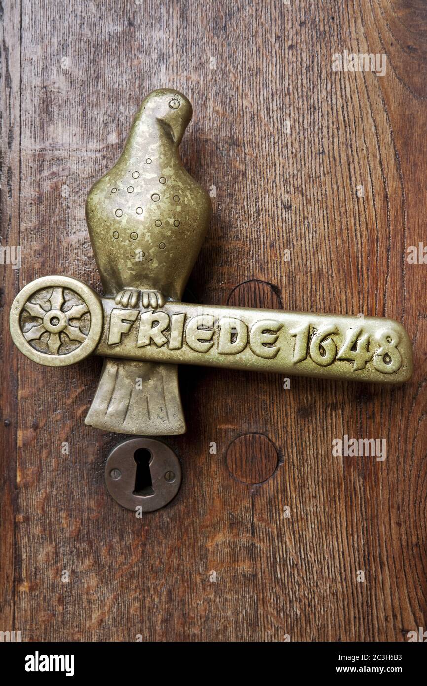 Door handle with lettering peace 1648, Westfaelischer Friede, town hal, Osnabrueck, Germany Stock Photo