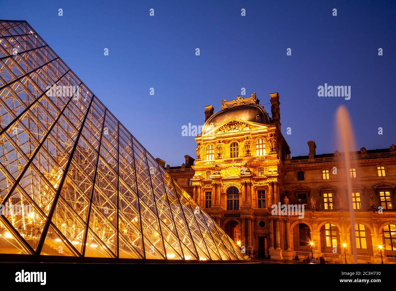 Courtyard of the Louvre, Paris, France, at dusk Stock Photo