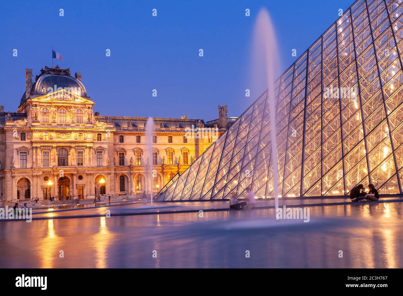 Courtyard of the Louvre, Paris, France, at dusk Stock Photo