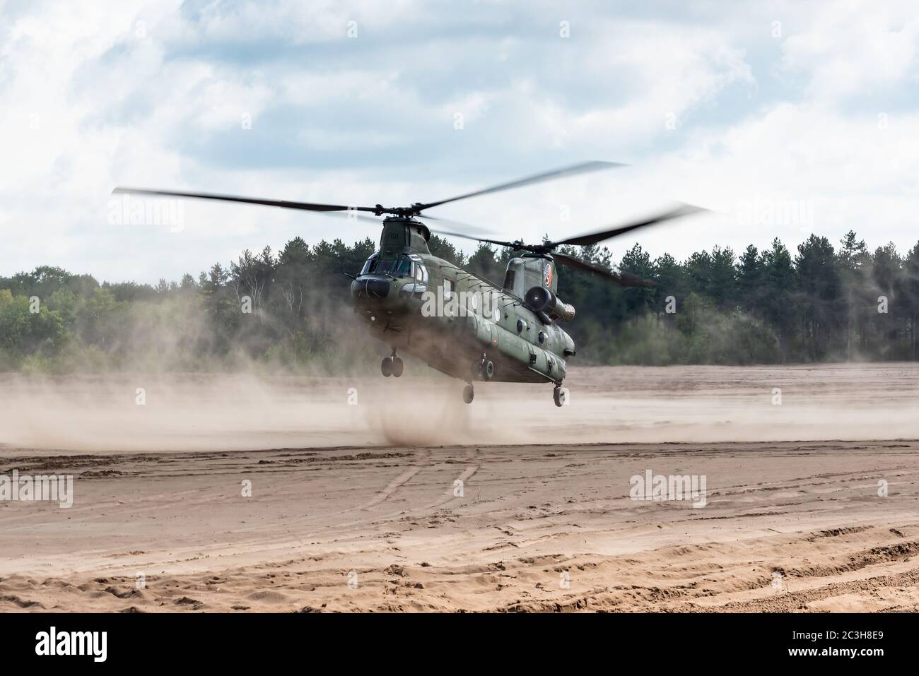 A Boeing CH-47 Chinook transport helicopter of the Royal Netherlands Air Force is ready to land at the GLV-5. Stock Photo