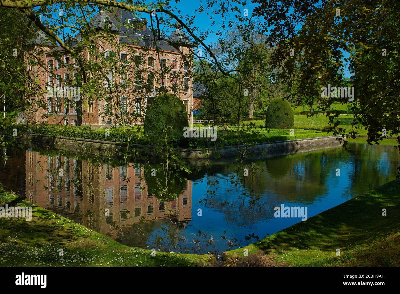 Mesmerizing scene of a pond with the Coloma castle in the background in Belgium Stock Photo