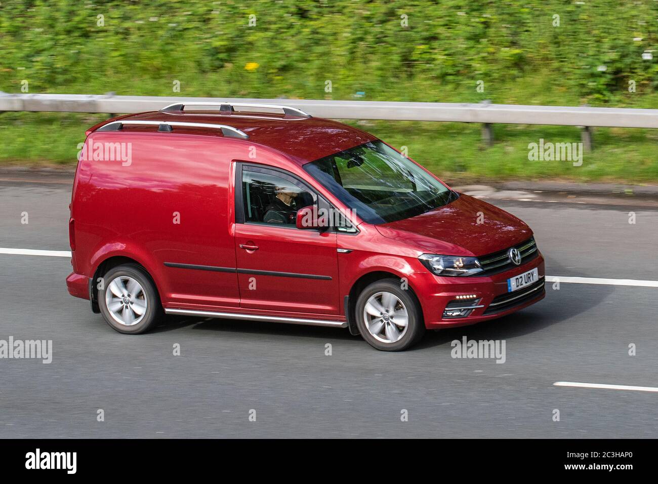 2016 red VW Volkswagen Caddy C20 Highline TDI; Vehicular traffic moving  vehicles, cars driving vehicle on UK roads, motors, motoring on the M6  motorway Stock Photo - Alamy