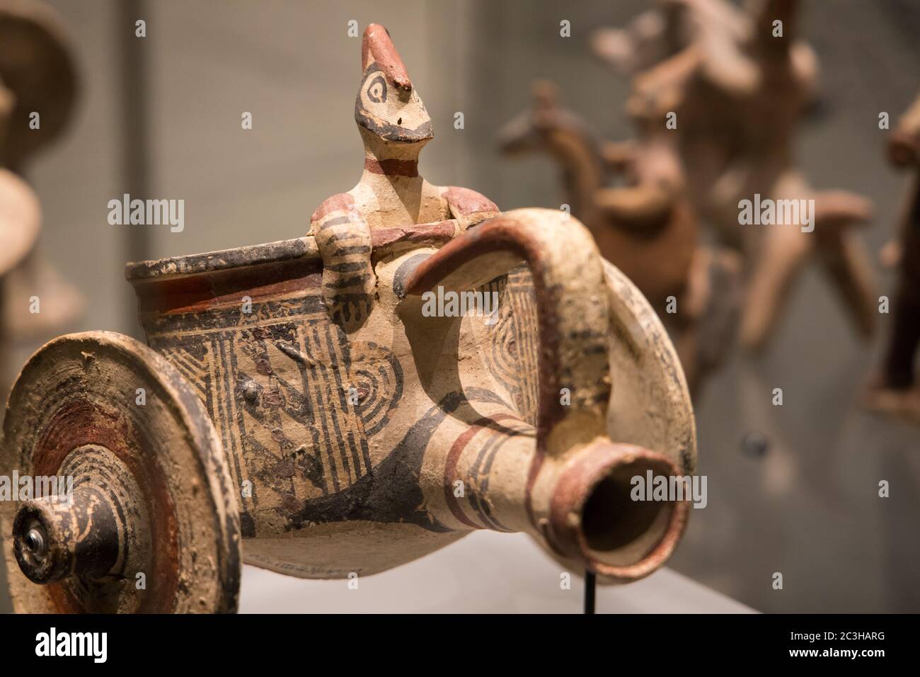 Leiden, The Netherlands - JAN 04, 2020: closeup of small terracotta warrior chariot figurine made from a jar from ancient Cyprus. Horse rider. Stock Photo