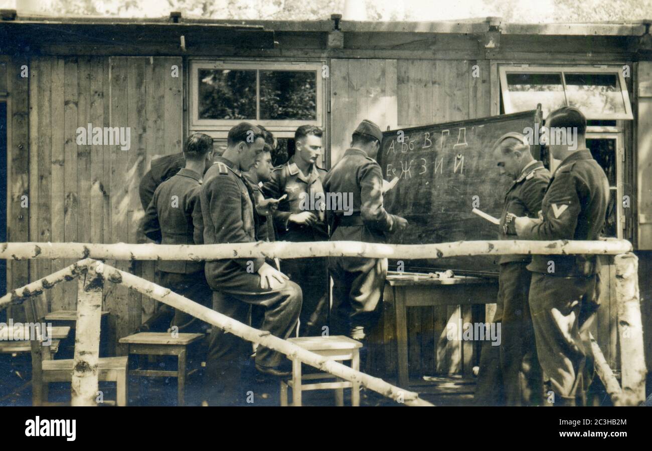 WW2 -Sirník Slovakia german luftwaffe soldiers learning cyrillic alphabet Stock Photo
