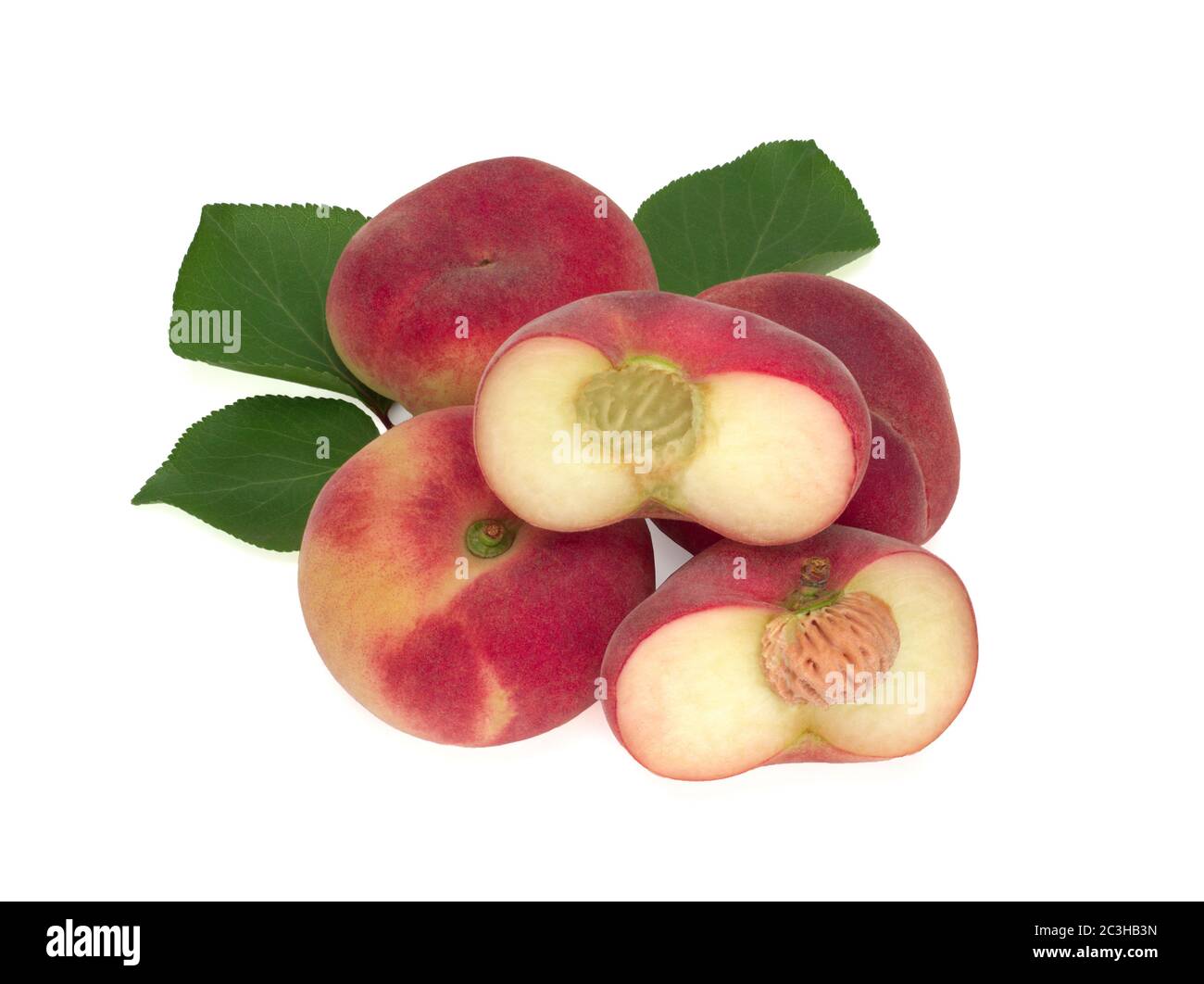 Peaches with leaves isolated on white Stock Photo